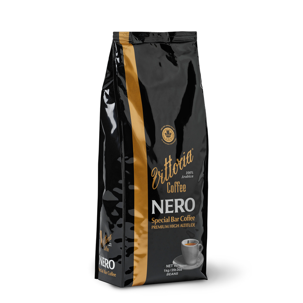 Nero Special Bar 1 kg dark‑roast coffee beans in a black bag with label, side shot of pack